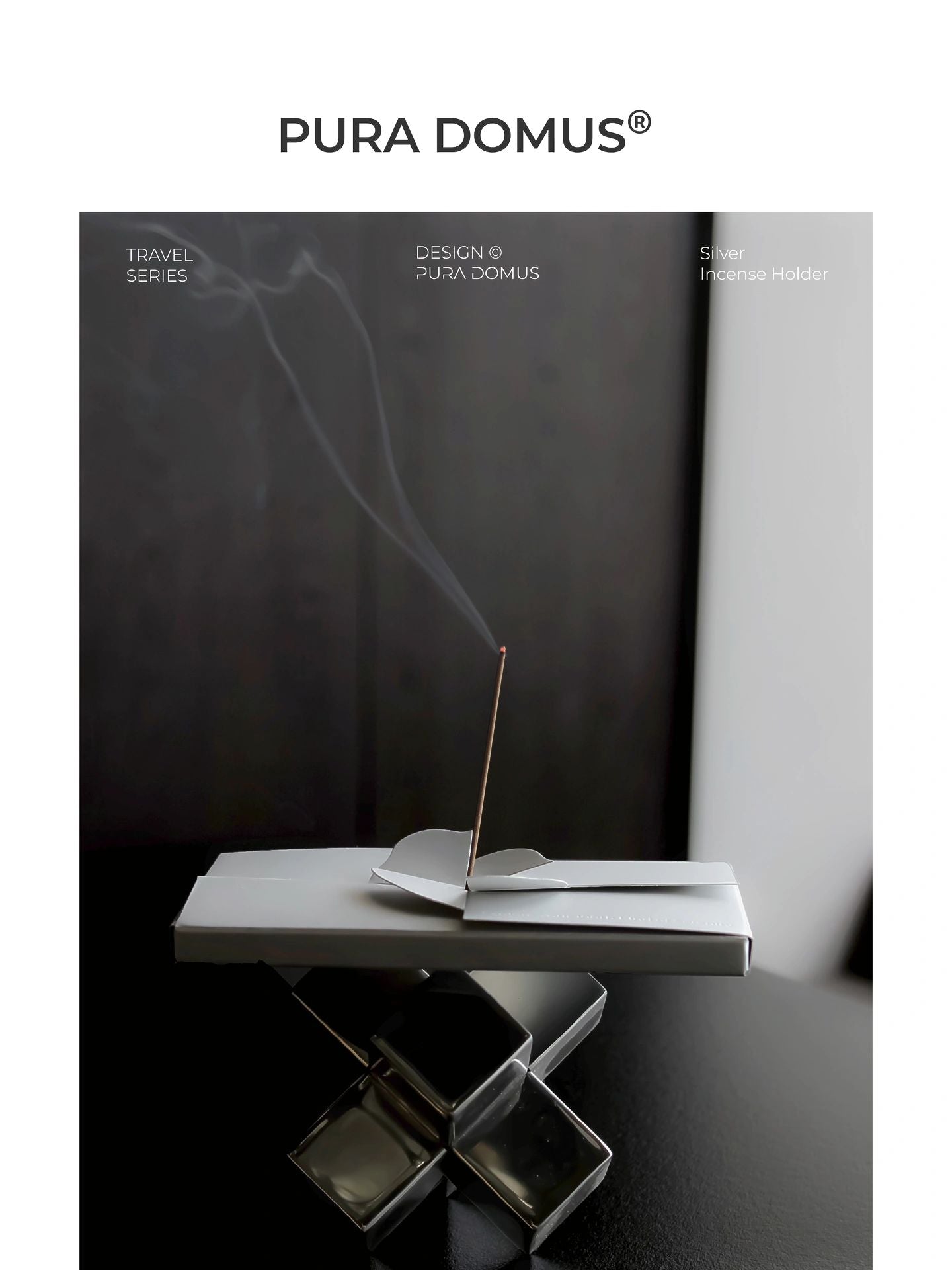 Lit incense stick with gentle swirling smoke, placed in a silver petal-shaped eco-friendly paper incense holder, creating a tranquil meditation ambiance